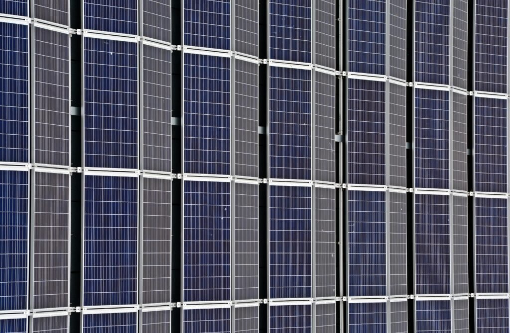 Close-up of multiple solar panels representing renewable energy and sustainability.